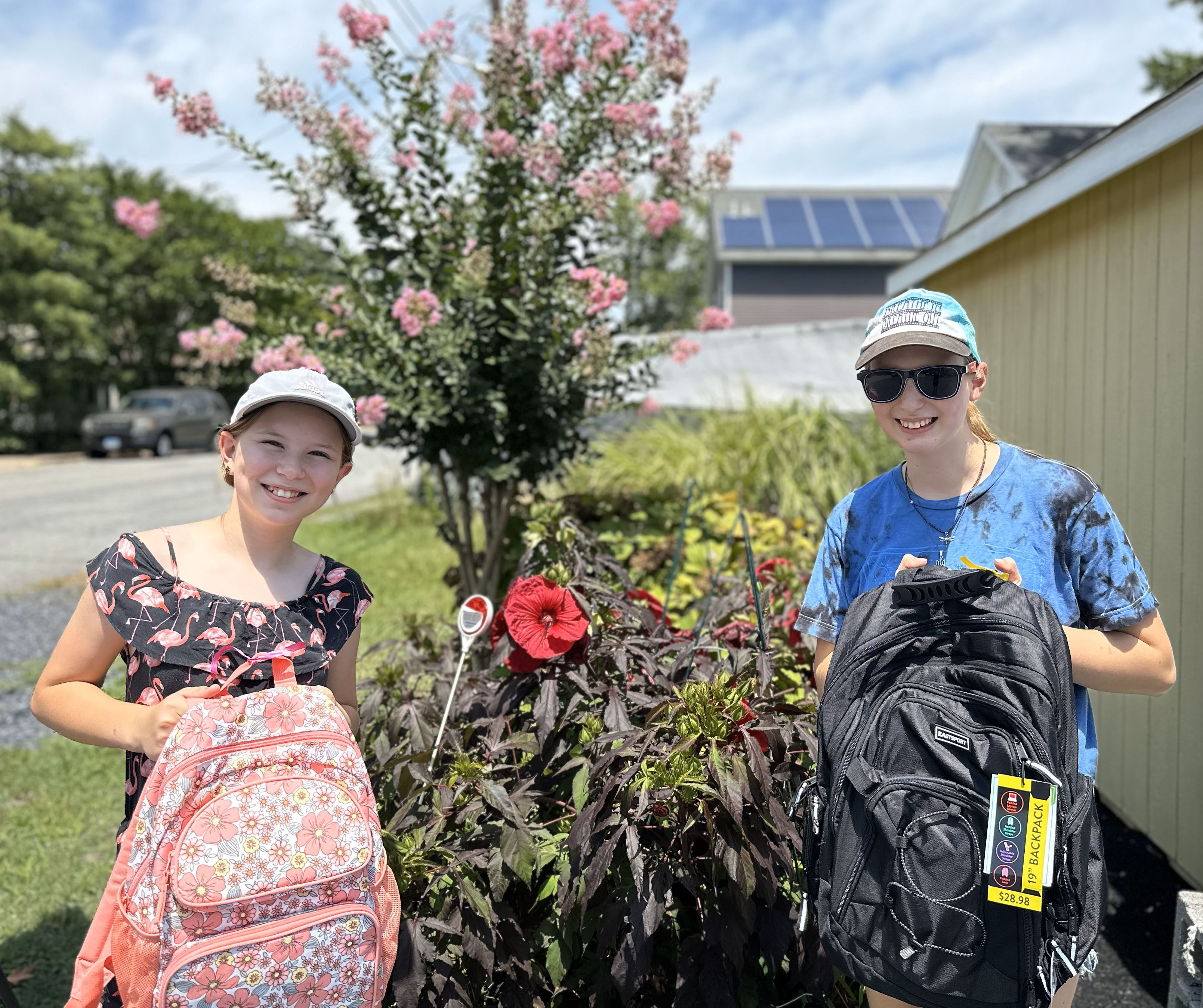 Students with backpack and school supplies